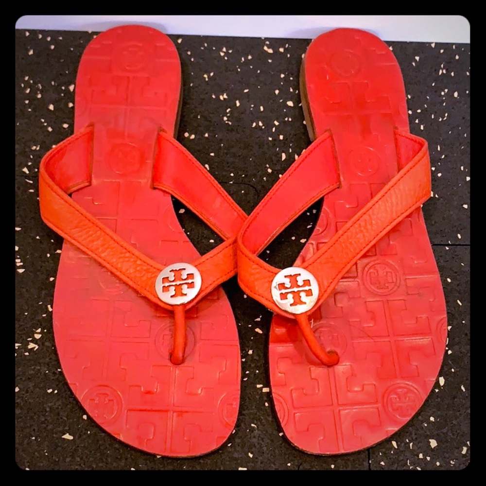 Red pebble leather flip flops